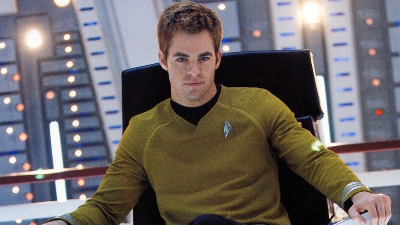 Captain Kirk sitting in the captain chair in "Star Trek" (2009)