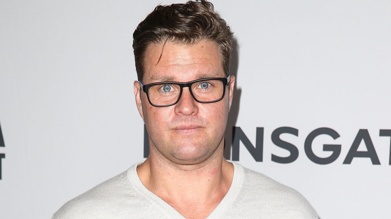Zachery Ty Bryan wearing black-rimmed glasses