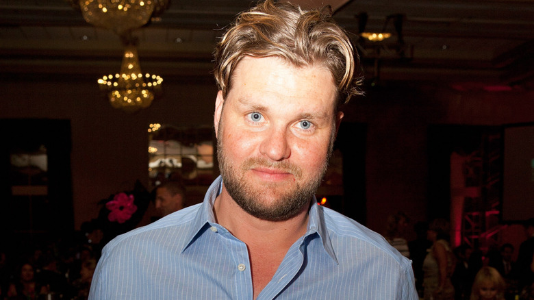 Zachery Ty Bryan wearing a blue shirt