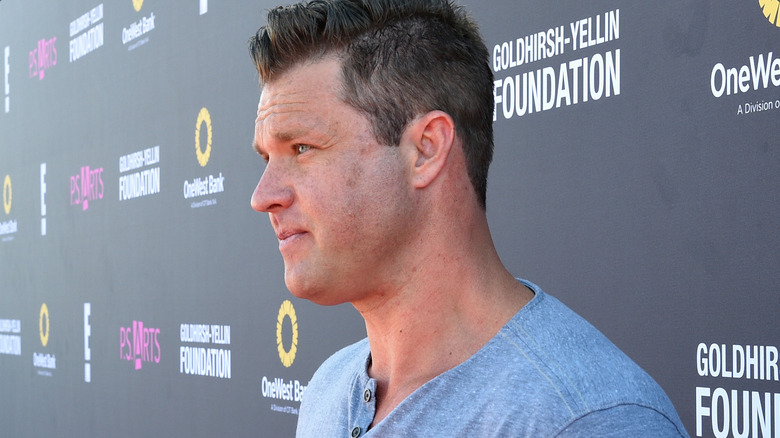 Zachery Ty Bryan wearing a grey T-shirt