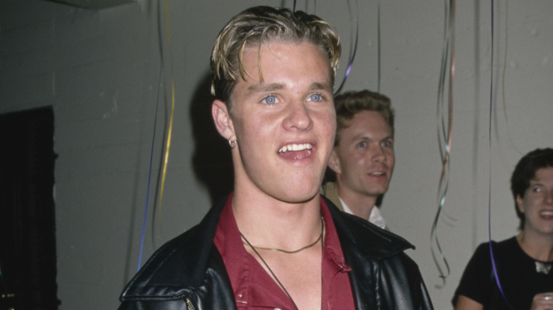 Zachery Ty Bryan wearing a leather jacket