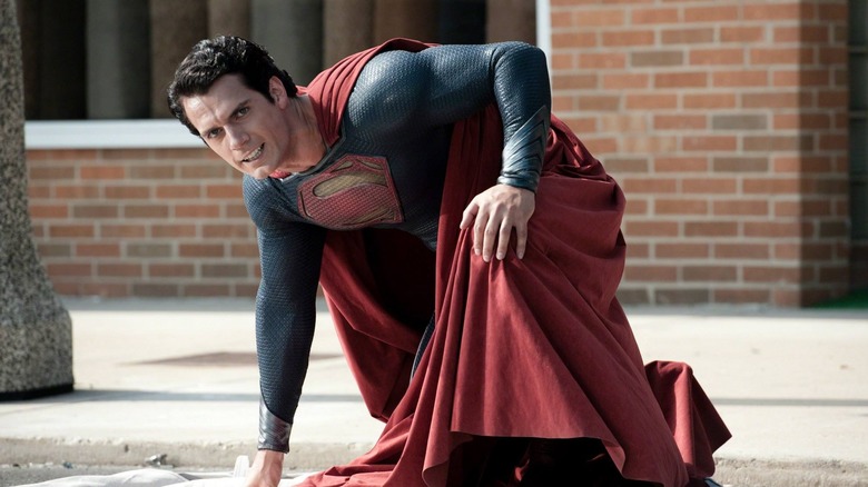 Superman kneeling on the street
