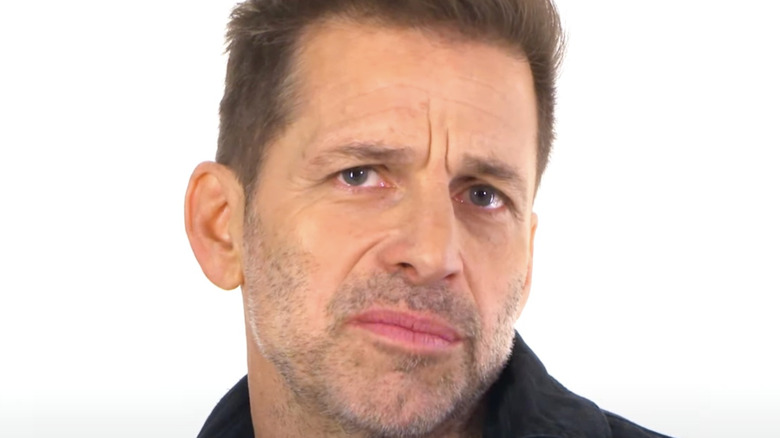 Zack Snyder grimacing into camera