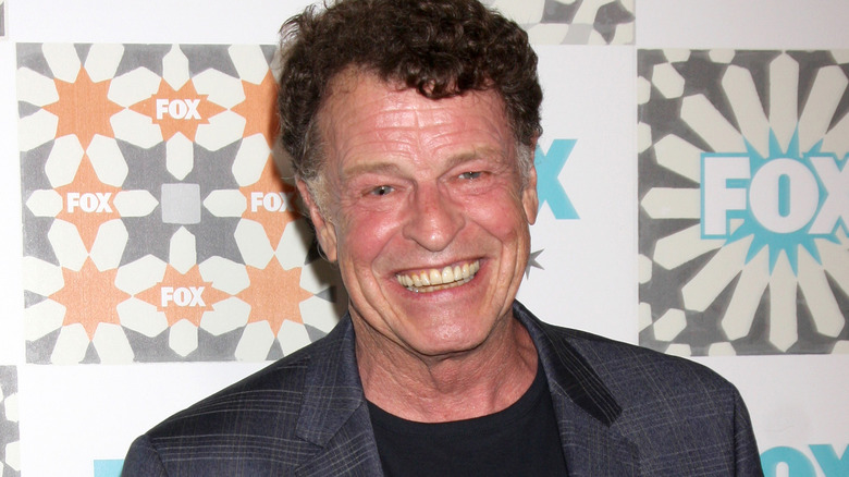 John Noble grins