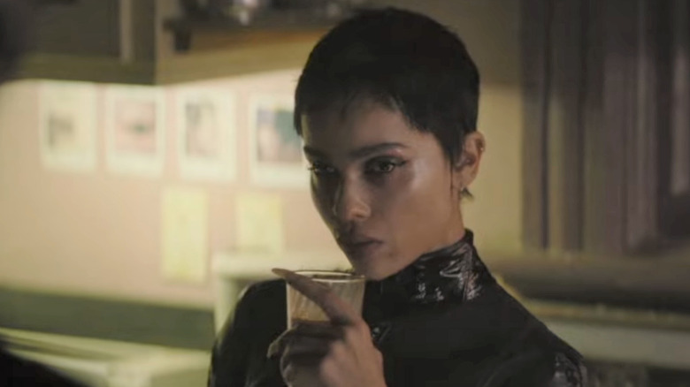 Selina Kyle sips a glass of milk